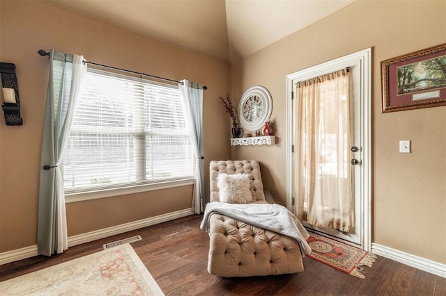 4417 Man O War Dr, Edmond, OK 73025 - sitting room featuring healthy amount of natural light, wood finished floors, and vaulted ceiling