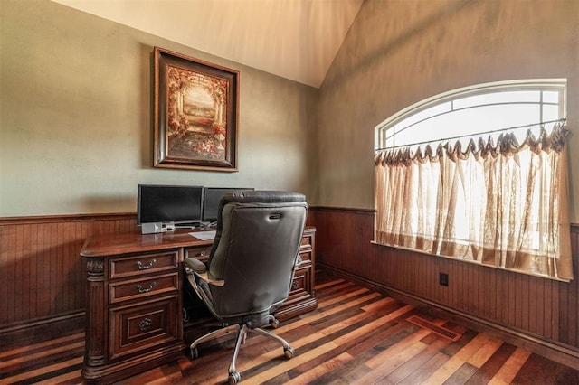 4417 Man O War Dr, Edmond, OK 73025 - office space featuring healthy amount of natural light, dark wood-style floors, wooden walls, wainscoting, and vaulted ceiling