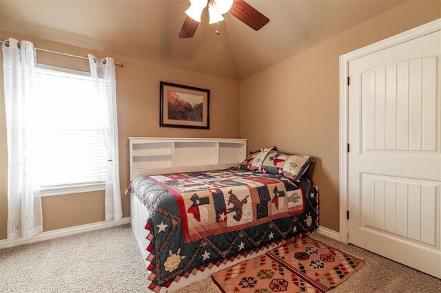 4417 Man O War Dr, Edmond, OK 73025 - carpeted bedroom with multiple windows, lofted ceiling, and a ceiling fan