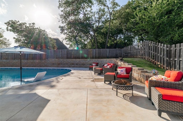 4417 Man O War Dr, Edmond, OK 73025 - view of swimming pool with an outdoor living space with a fire pit, a patio, and a fenced backyard