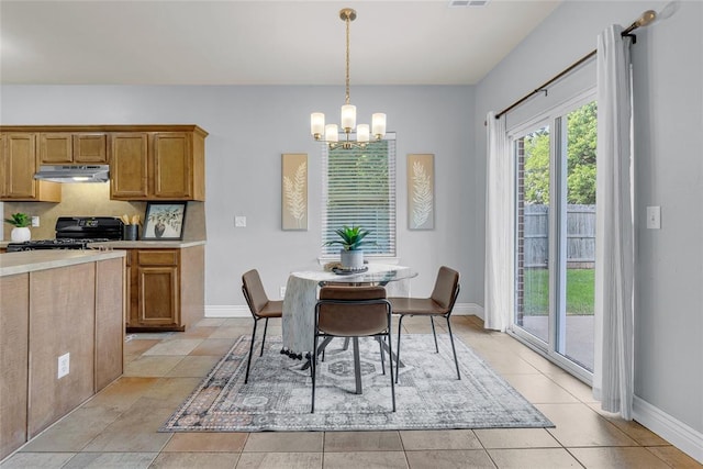 16117 Sonoma Lake Blvd, Edmond, OK 73013 - dining area featuring a chandelier and light tile patterned floors
