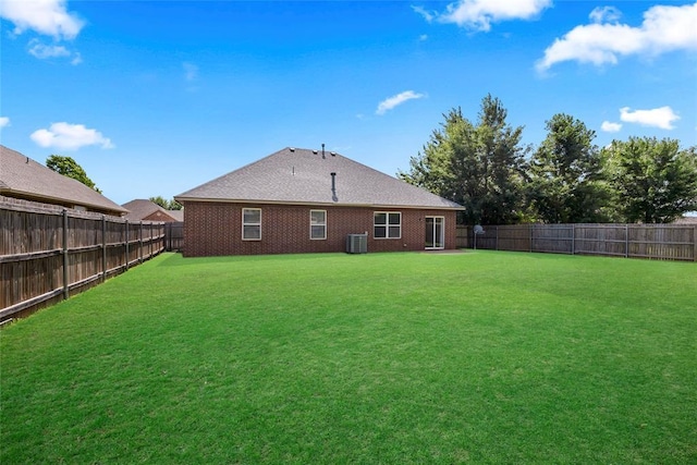 16117 Sonoma Lake Blvd, Edmond, OK 73013 - rear view of house with a fenced backyard and brick siding