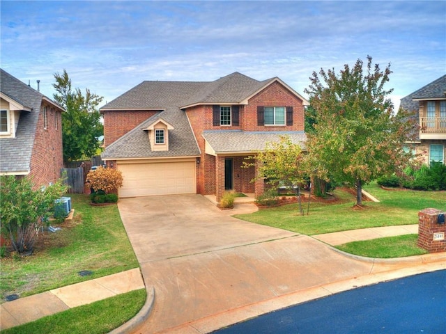 3441 NW 176th St, Edmond, OK 73012 - traditional-style home featuring brick siding, a garage, a front yard, driveway, and roof with shingles