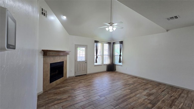 3441 NW 176th St, Edmond, OK 73012 - unfurnished living room with ceiling fan, wood finished floors, vaulted ceiling, and a fireplace