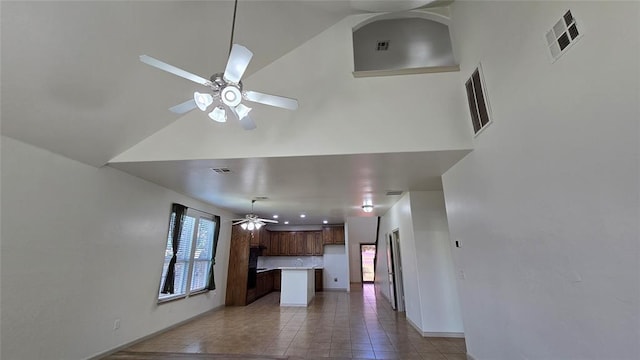 3441 NW 176th St, Edmond, OK 73012 - kitchen with ceiling fan, open floor plan, light countertops, tasteful backsplash, and tile patterned flooring