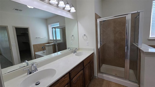 3441 NW 176th St, Edmond, OK 73012 - full bath featuring a shower stall, tile patterned flooring, double vanity, and a bathtub