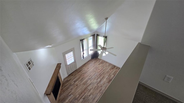 3441 NW 176th St, Edmond, OK 73012 - unfurnished living room featuring lofted ceiling, a ceiling fan, and wood finished floors