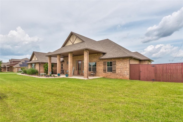 11620 Mallorca Dr, Oklahoma City, OK 73173 - back of property with brick siding, a patio area, and roof with shingles
