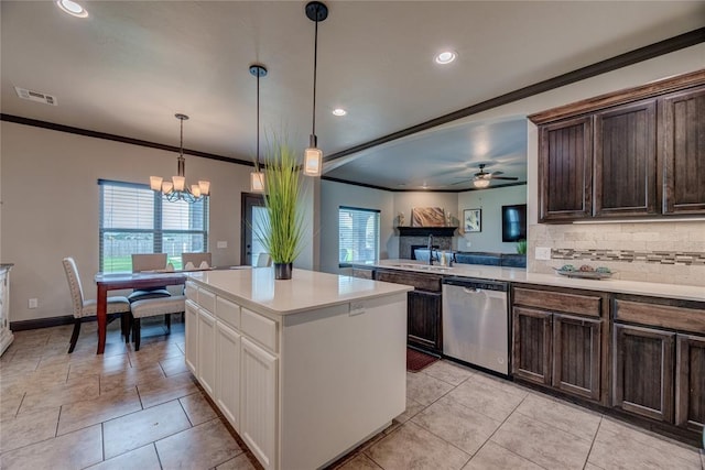 11620 Mallorca Dr, Oklahoma City, OK 73173 - kitchen featuring stainless steel dishwasher, ceiling fan, light countertops, dark brown cabinets, and tasteful backsplash