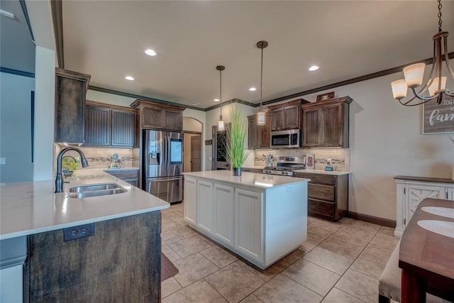 11620 Mallorca Dr, Oklahoma City, OK 73173 - kitchen with stainless steel appliances, decorative backsplash, light countertops, a chandelier, and ornamental molding