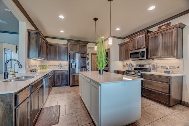 11620 Mallorca Dr, Oklahoma City, OK 73173 - kitchen with stainless steel appliances, decorative backsplash, light countertops, a center island, and recessed lighting