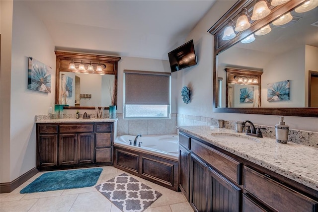 11620 Mallorca Dr, Oklahoma City, OK 73173 - bathroom featuring two vanities, tile patterned flooring, and a garden tub
