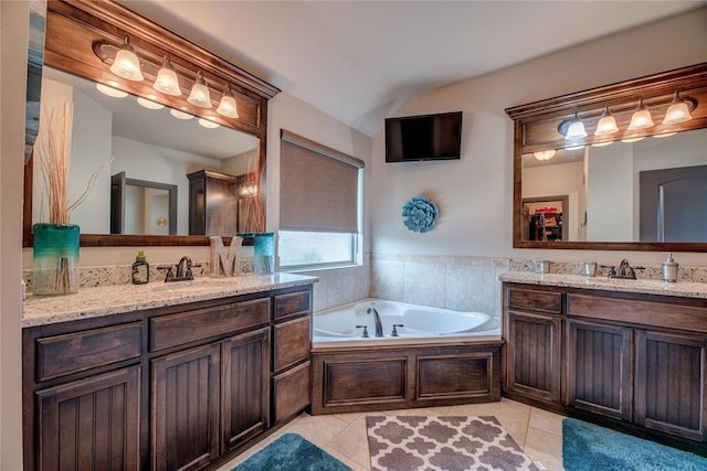 11620 Mallorca Dr, Oklahoma City, OK 73173 - full bath featuring two vanities, tile patterned floors, a garden tub, and vaulted ceiling