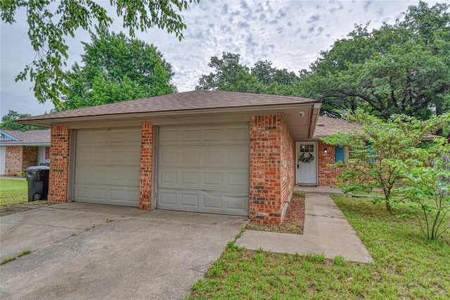 1540 Bradley Pl, Oklahoma City, OK 73127 - single story home featuring concrete driveway, brick siding, an attached garage, and roof with shingles