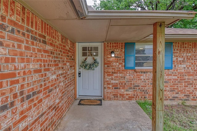 1540 Bradley Pl, Oklahoma City, OK 73127 - doorway to property featuring brick siding