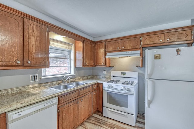1540 Bradley Pl, Oklahoma City, OK 73127 - kitchen featuring white appliances, under cabinet range hood, and brown cabinets