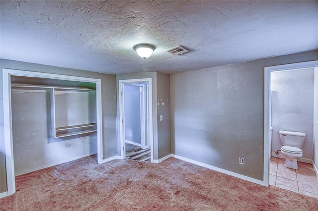 1540 Bradley Pl, Oklahoma City, OK 73127 - unfurnished bedroom featuring carpet floors, a closet, and ensuite bath