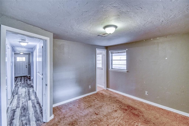 1540 Bradley Pl, Oklahoma City, OK 73127 - empty room with carpet flooring and a textured ceiling