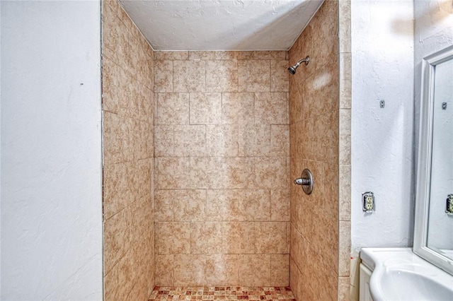 1540 Bradley Pl, Oklahoma City, OK 73127 - bathroom with a tile shower and a textured wall