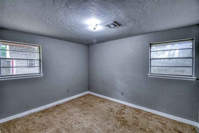 1540 Bradley Pl, Oklahoma City, OK 73127 - unfurnished room featuring carpet and a textured ceiling