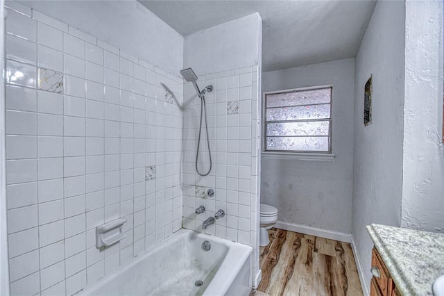 1540 Bradley Pl, Oklahoma City, OK 73127 - bathroom with wood finished floors, vanity, and bathing tub / shower combination