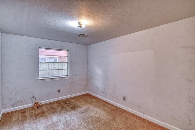 1540 Bradley Pl, Oklahoma City, OK 73127 - carpeted empty room featuring baseboards and a textured ceiling
