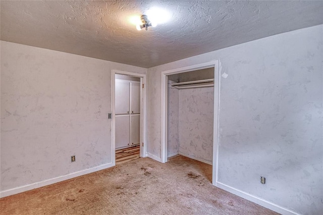 1540 Bradley Pl, Oklahoma City, OK 73127 - unfurnished bedroom featuring carpet, a closet, and a textured ceiling