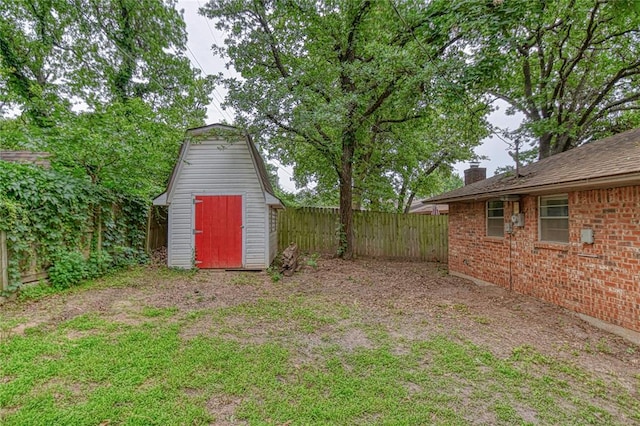 1540 Bradley Pl, Oklahoma City, OK 73127 - fenced backyard featuring a storage unit
