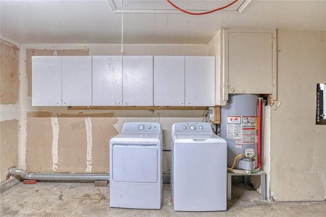 1540 Bradley Pl, Oklahoma City, OK 73127 - laundry area featuring gas water heater, attic access, cabinet space, and washer and dryer
