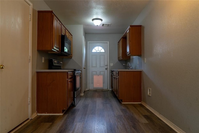 1001 Hyacinth Hollow Dr, Yukon, OK 73099 - kitchen featuring stainless steel electric range oven, black microwave, brown cabinetry, dark wood finished floors, and light countertops