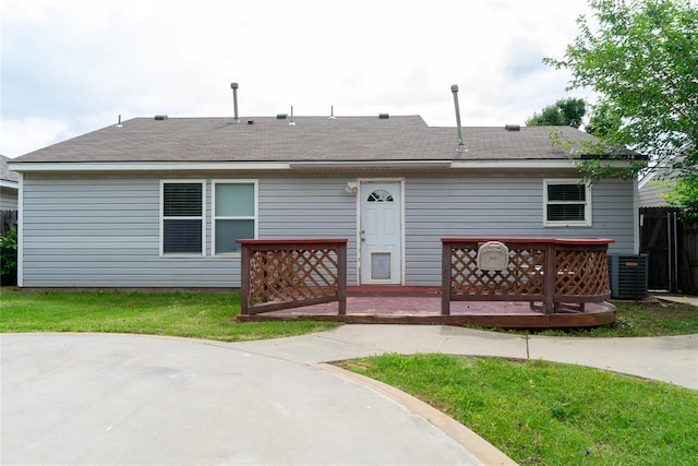1001 Hyacinth Hollow Dr, Yukon, OK 73099 - back of house with a wooden deck, a shingled roof, a patio, and a lawn