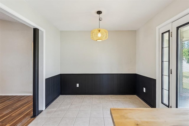 2309 Morning Glory Dr, Oklahoma City, OK 73159 - spare room with a wainscoted wall and light tile patterned floors