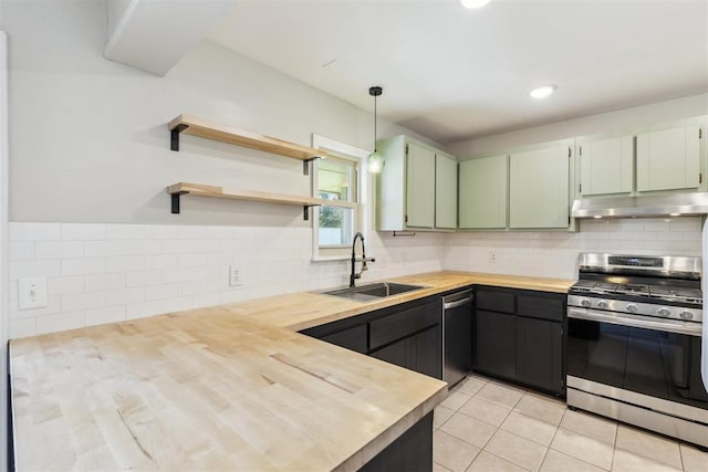 2309 Morning Glory Dr, Oklahoma City, OK 73159 - kitchen featuring appliances with stainless steel finishes, under cabinet range hood, butcher block countertops, green cabinets, and light tile patterned floors