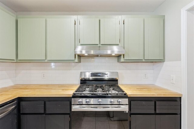 2309 Morning Glory Dr, Oklahoma City, OK 73159 - kitchen with exhaust hood, butcher block countertops, appliances with stainless steel finishes, and decorative backsplash