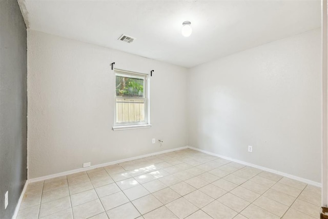 2309 Morning Glory Dr, Oklahoma City, OK 73159 - empty room featuring light tile patterned floors and baseboards