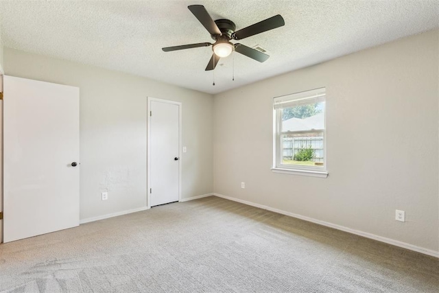 2309 Morning Glory Dr, Oklahoma City, OK 73159 - unfurnished bedroom featuring carpet, a textured ceiling, and ceiling fan