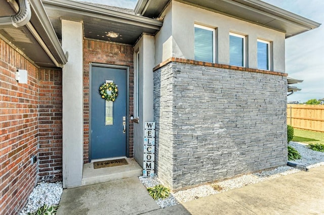 17333 Shadow Hawk Ln, Edmond, OK 73012 - property entrance with brick siding and stucco siding