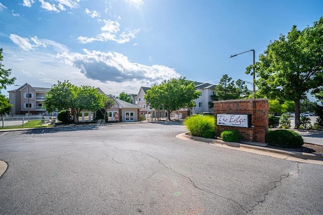 2200 Classen Blvd Unit 2131, Norman, OK 73107 - view of asphalt road with curbs, street lighting, and a residential view