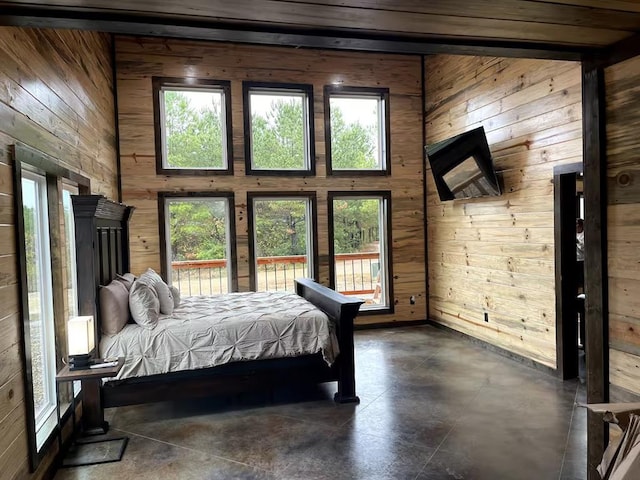 17 Honor Ct, Broken Bow, OK 74728 - bedroom with wooden walls and concrete floors