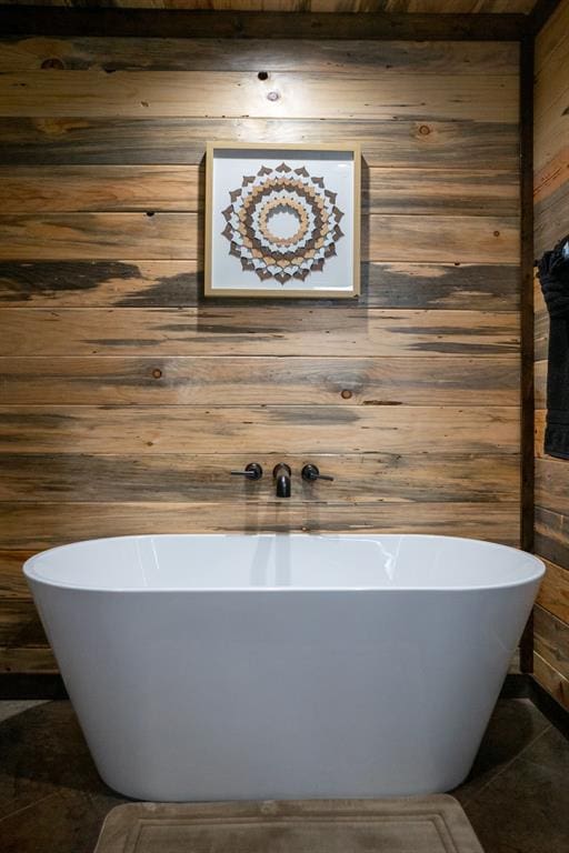 17 Honor Ct, Broken Bow, OK 74728 - full bathroom featuring tile patterned flooring, a soaking tub, and wooden walls