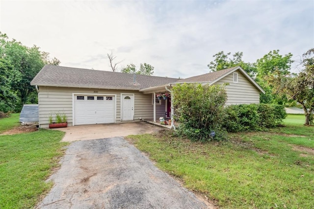 300 S Davidson Rd, Midwest City, OK 73130 - ranch-style house with asphalt driveway, an attached garage, and a front lawn