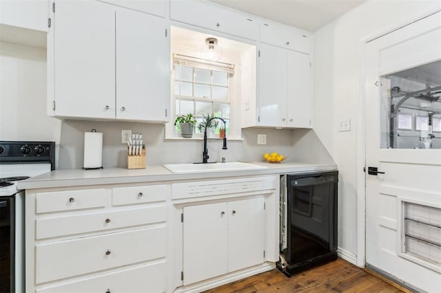 300 S Davidson Rd, Midwest City, OK 73130 - kitchen with white electric stove, dishwasher, light countertops, white cabinetry, and dark wood-style flooring