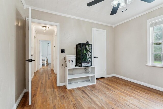 300 S Davidson Rd, Midwest City, OK 73130 - bedroom featuring ornamental molding, wood-type flooring, attic access, and ceiling fan