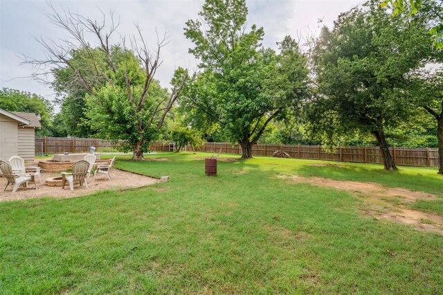 300 S Davidson Rd, Midwest City, OK 73130 - fenced backyard featuring a fire pit