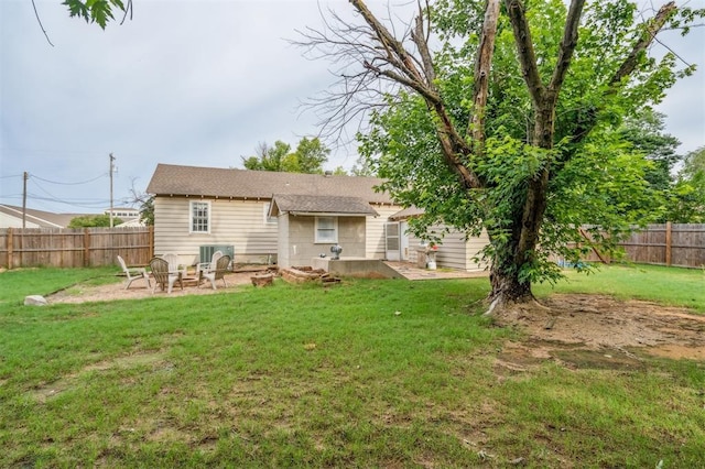 300 S Davidson Rd, Midwest City, OK 73130 - rear view of house featuring a fenced backyard, a patio, and an outdoor fire pit