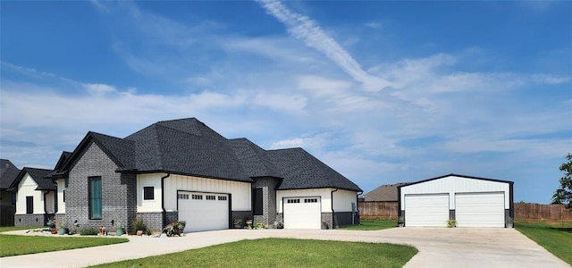 26784 Stirrup Ct, Blanchard, OK 73010 - view of front of house with an outbuilding, board and batten siding, and roof with shingles