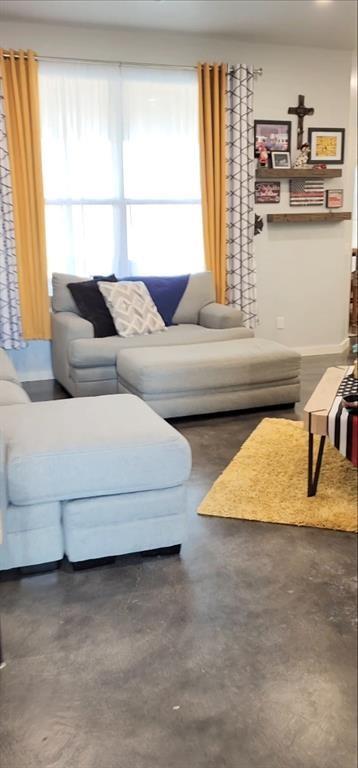 26784 Stirrup Ct, Blanchard, OK 73010 - living room featuring finished concrete flooring