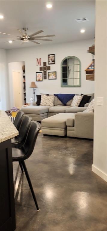 26784 Stirrup Ct, Blanchard, OK 73010 - living room featuring concrete flooring, recessed lighting, and ceiling fan