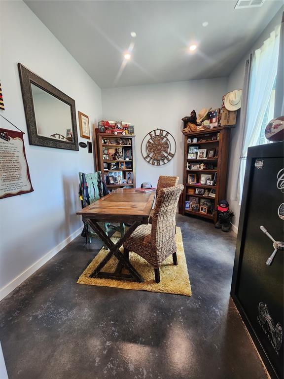 26784 Stirrup Ct, Blanchard, OK 73010 - dining area featuring finished concrete floors and an office area