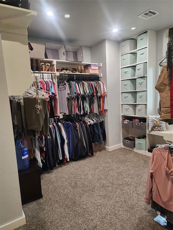 26784 Stirrup Ct, Blanchard, OK 73010 - walk in closet with carpet floors